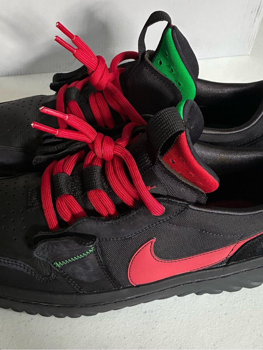 Nike Men’s Black Sneakers with Red Swoosh and Red Laces